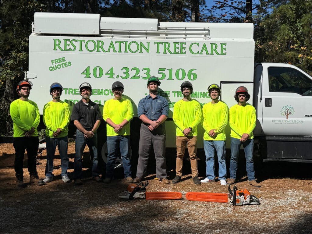 Restoration Tree Care tree removal service crew standing in front of a company truck